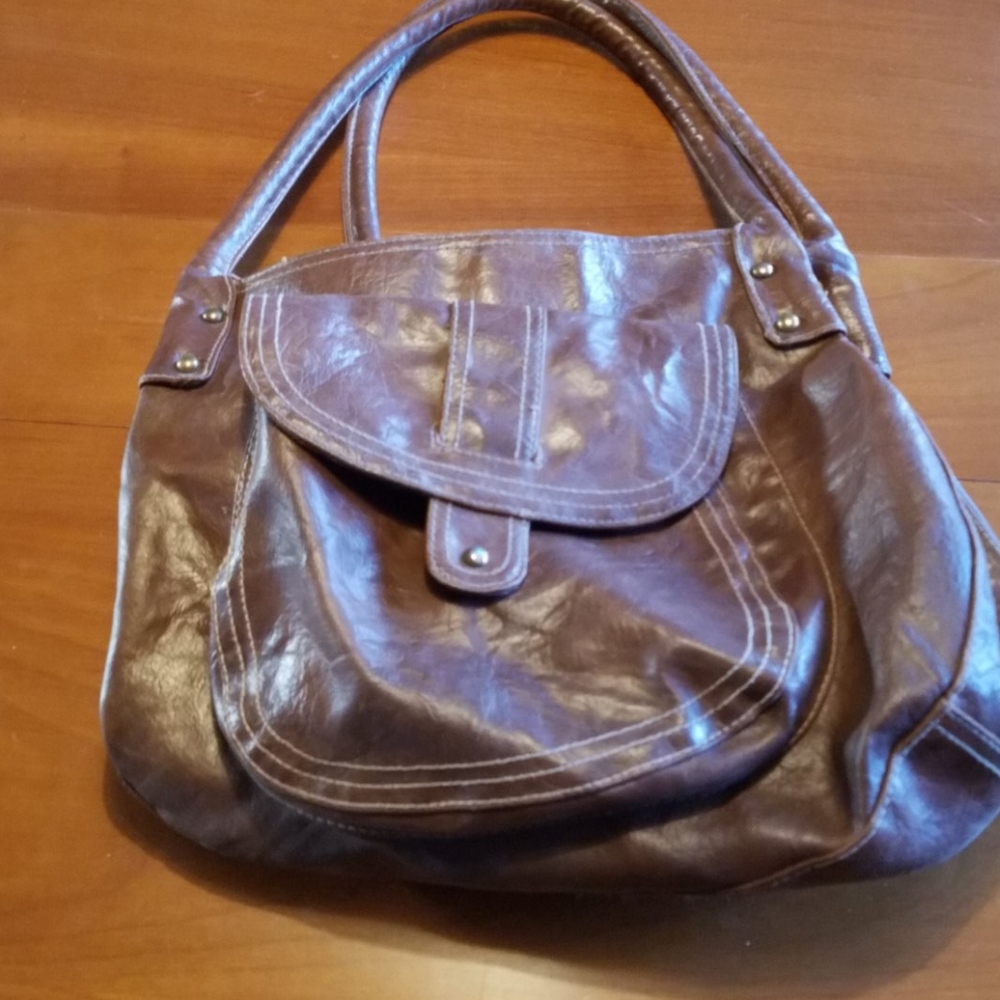 Well loved brown leather shoulder bag